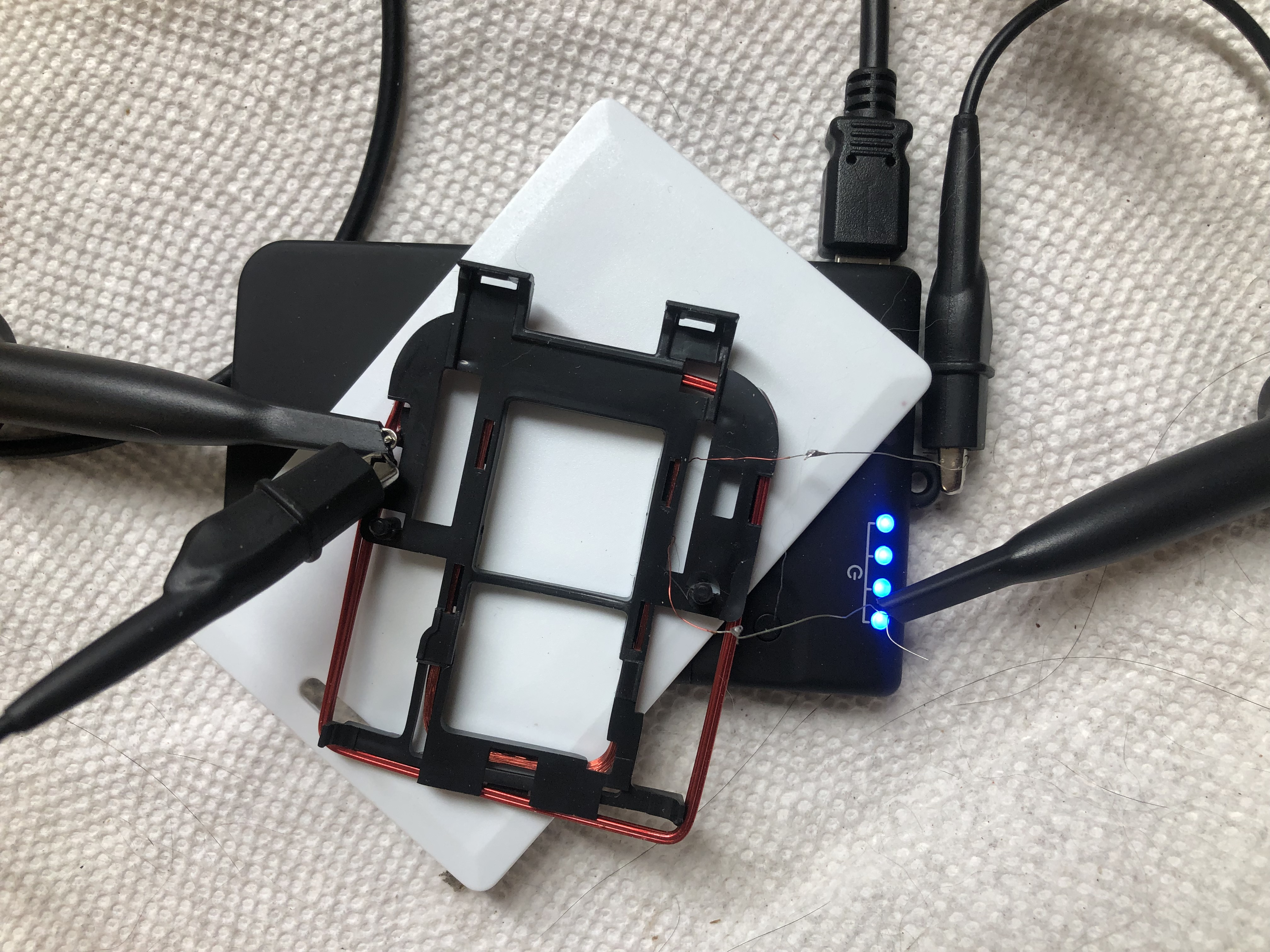 Image of RFID reader, card, and coil stacked